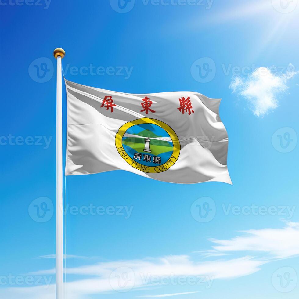 Waving flag of Pingtung County is a region of Taiwan on flagpole photo