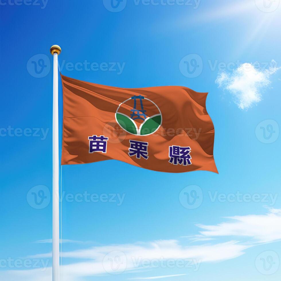 Waving flag of Miaoli County is a region of Taiwan on flagpole photo