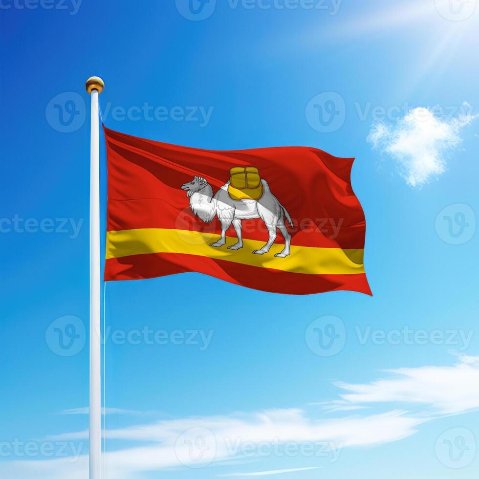 Waving flag of Chelyabinsk is a region of Russia on flagpole photo