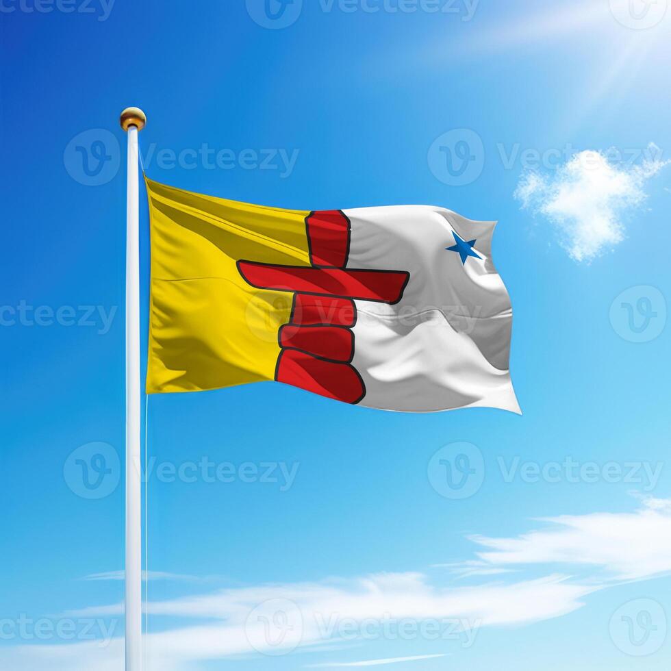 Waving flag of Nunavut is a province of Canada on flagpole photo