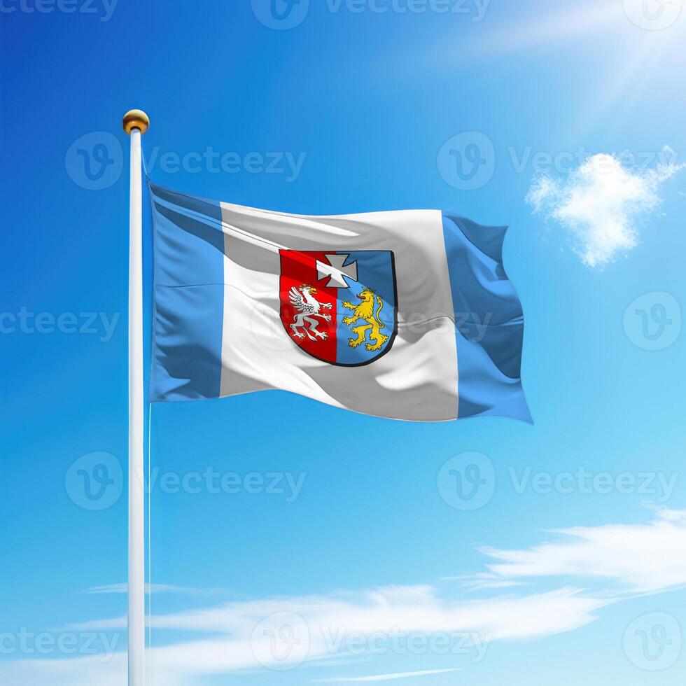 Waving flag of Subcarpathia is a region of Poland on flagpole photo