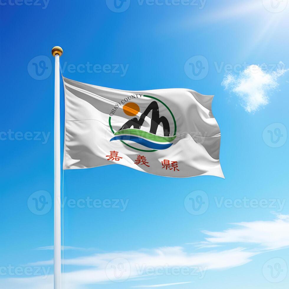 Waving flag of Chiayi County is a region of Taiwan on flagpole photo