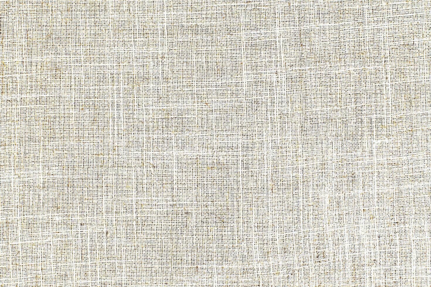Natural linen material textile canvas Fabric texture background Close-up detail of fabric natural color Hemp material pattern design wallpaper. can be used as background or for graphic design photo