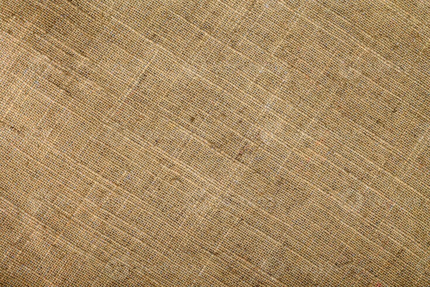 Natural linen material textile canvas Fabric texture background Close-up detail of fabric natural color Hemp material pattern design wallpaper. can be used as background or for graphic design photo