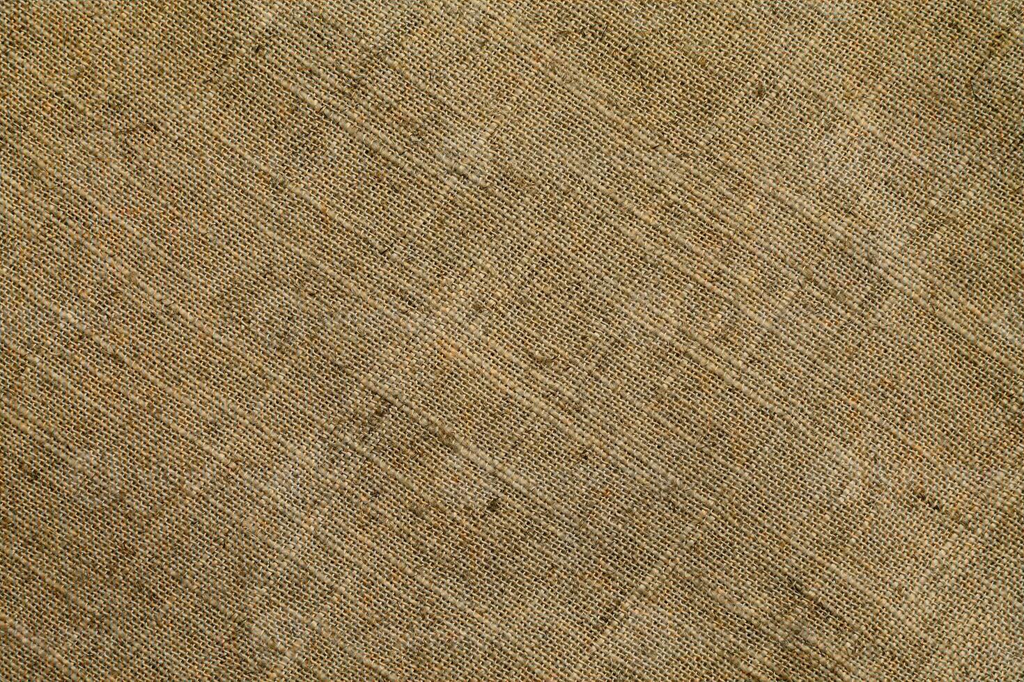Natural linen material textile canvas Fabric texture background Close-up detail of fabric natural color Hemp material pattern design wallpaper. can be used as background or for graphic design photo