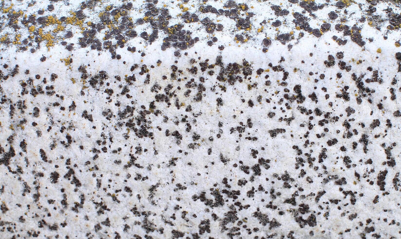 Abstract natural rock stone granite grunge rusty metal texture design background natural color stone material granite design wallpaper. Close-up detail of natural stone photo