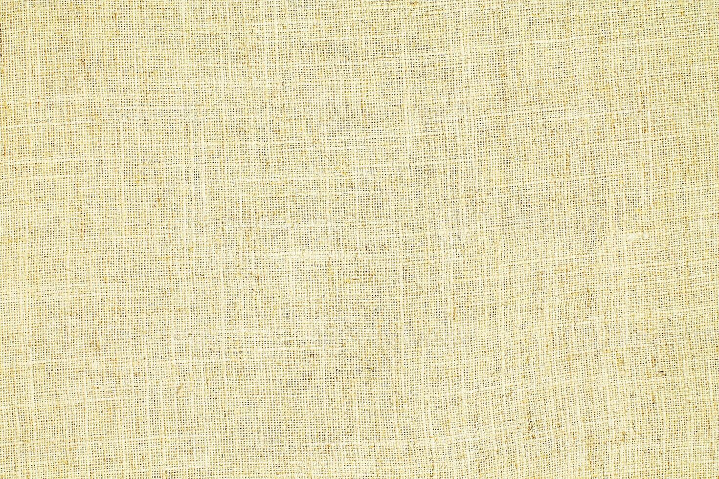 Natural linen material textile canvas Fabric texture background Close-up detail of fabric natural color Hemp material pattern design wallpaper. can be used as background or for graphic design photo