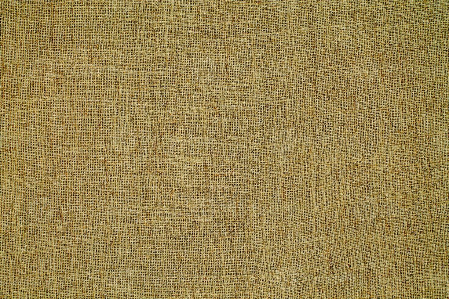Natural linen material textile canvas Fabric texture background Close-up detail of fabric natural color Hemp material pattern design wallpaper. can be used as background or for graphic design photo