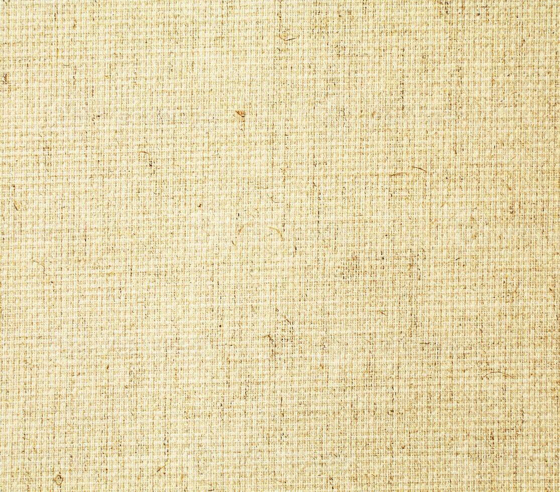 Natural linen material textile canvas Fabric texture background Close-up detail of fabric natural color Hemp material pattern design wallpaper. can be used as background or for graphic design photo