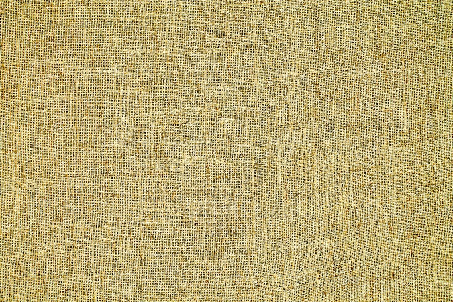 Natural linen material textile canvas Fabric texture background Close-up detail of fabric natural color Hemp material pattern design wallpaper. can be used as background or for graphic design photo