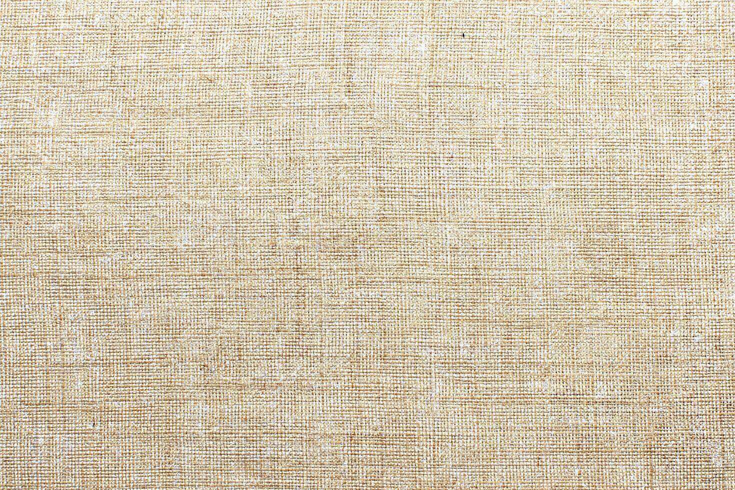 Natural linen material textile canvas Fabric texture background Close-up detail of fabric natural color Hemp material pattern design wallpaper. can be used as background or for graphic design photo