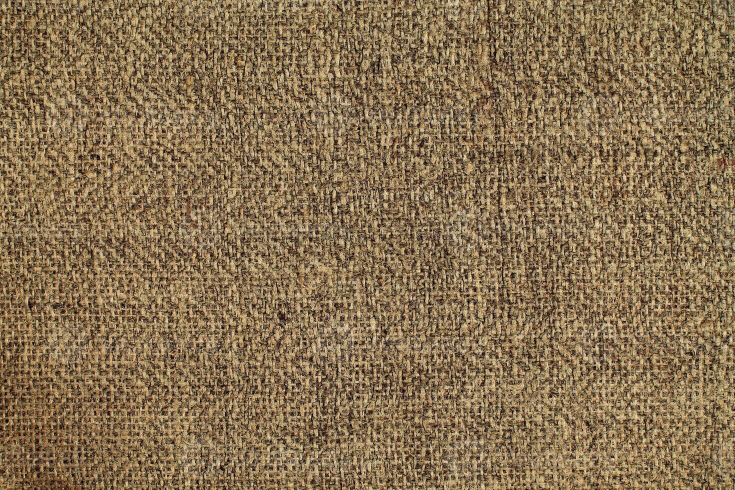 Natural linen material textile canvas Fabric texture background Close-up detail of fabric natural color Hemp material pattern design wallpaper. can be used as background or for graphic design photo