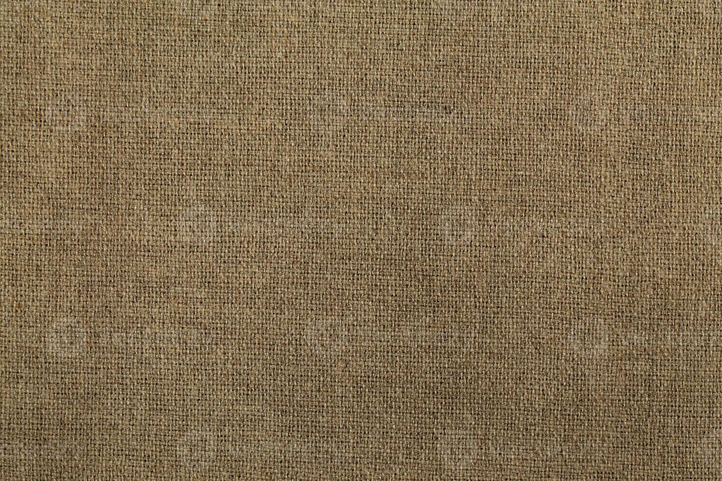 Natural linen material textile canvas Fabric texture background Close-up detail of fabric natural color Hemp material pattern design wallpaper. can be used as background or for graphic design photo