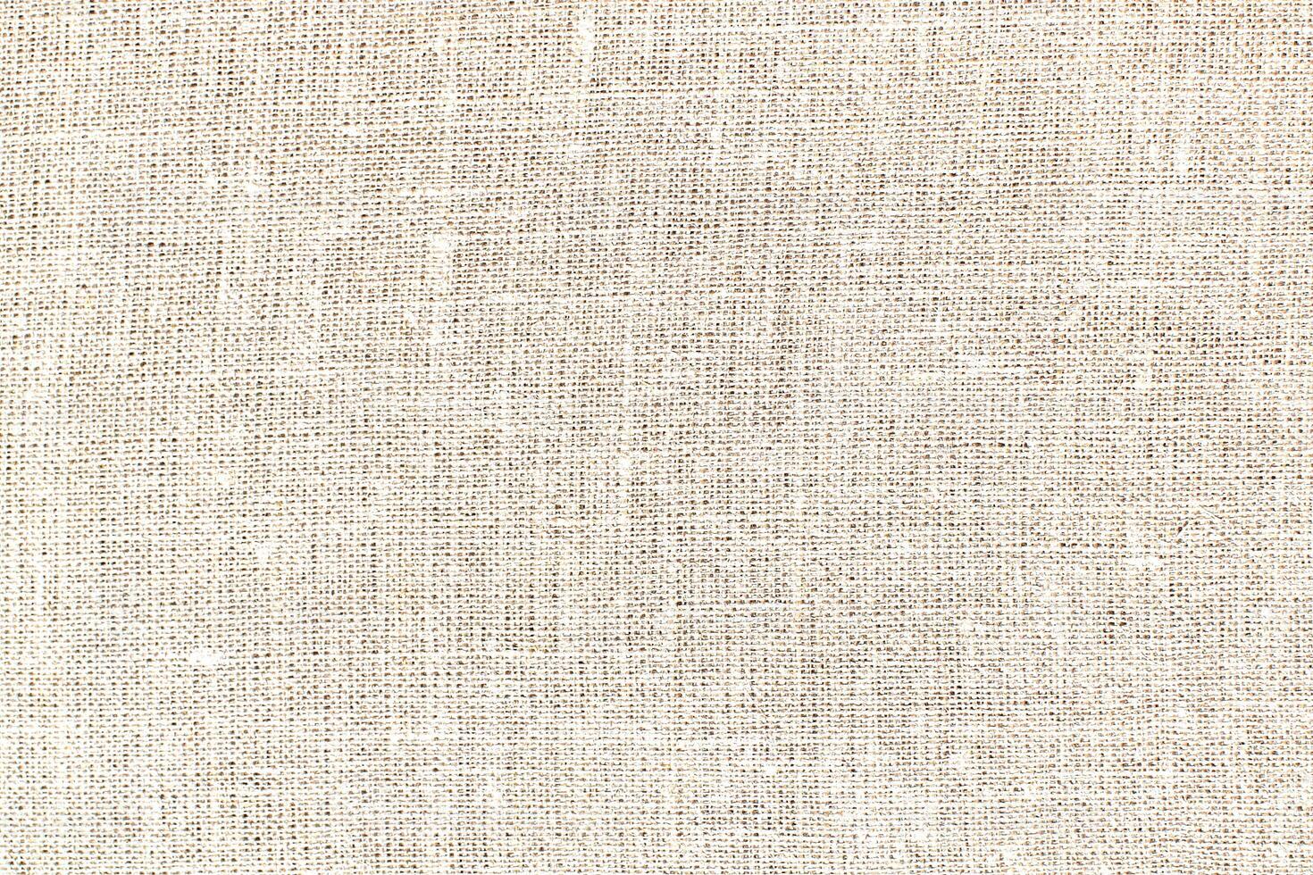 Natural linen material textile canvas Fabric texture background Close-up detail of fabric natural color Hemp material pattern design wallpaper. can be used as background or for graphic design photo