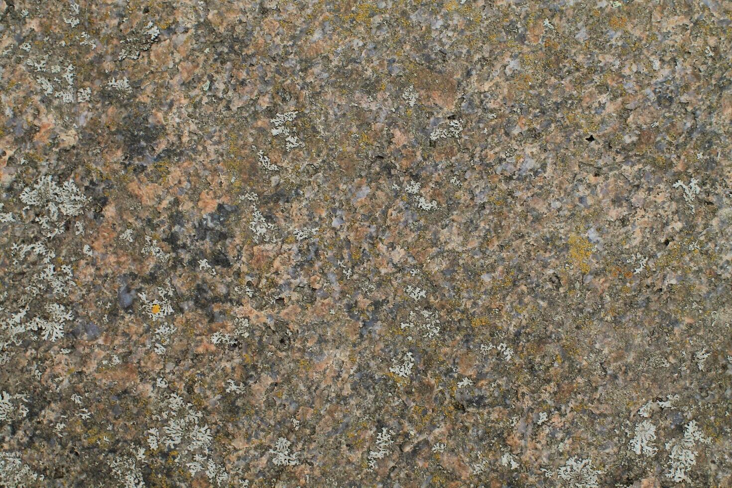 Abstract natural rock stone granite grunge rusty metal texture design background natural color stone material granite design wallpaper. Close-up detail of natural stone photo