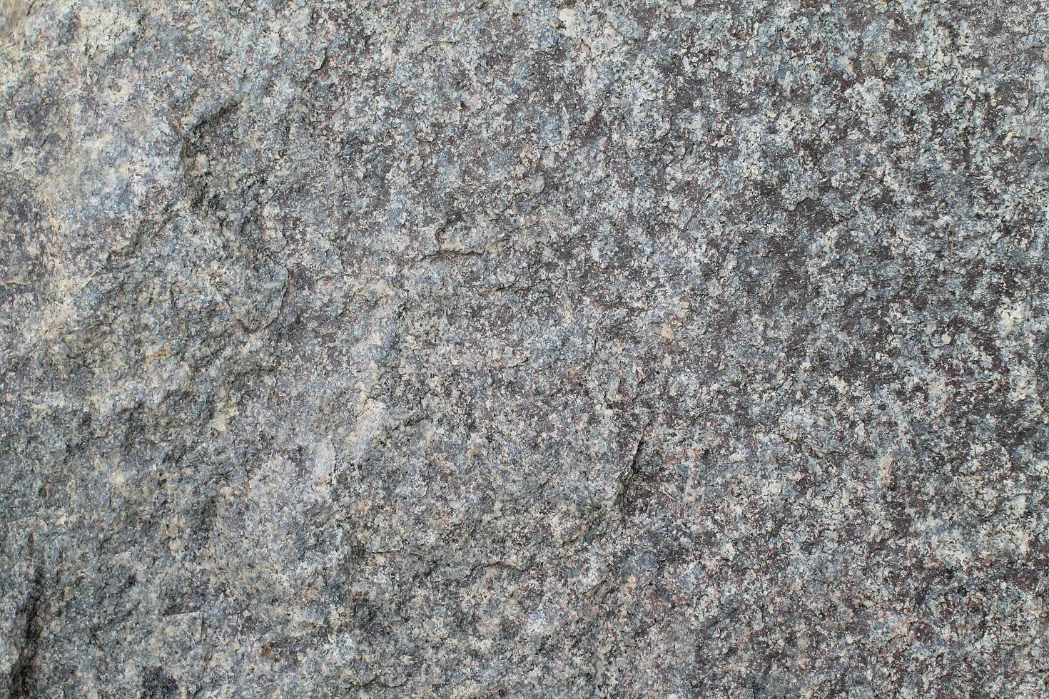 Abstract natural rock stone granite grunge rusty metal texture design background natural color stone material granite design wallpaper. Close-up detail of natural stone photo