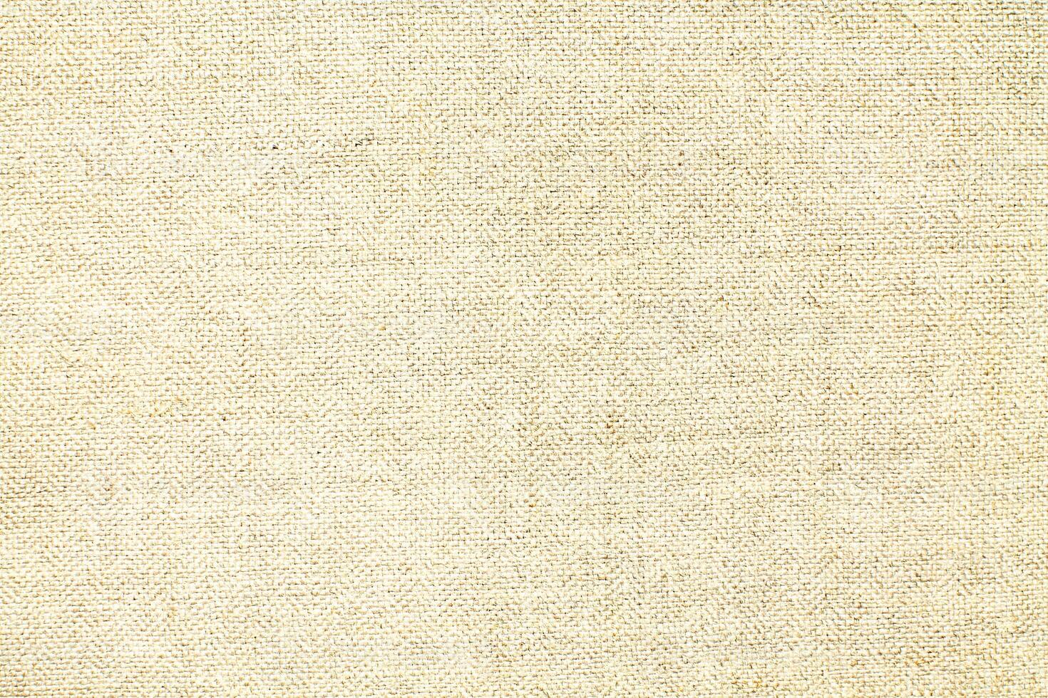 Natural linen material textile canvas Fabric texture background Close-up detail of fabric natural color Hemp material pattern design wallpaper. can be used as background or for graphic design photo