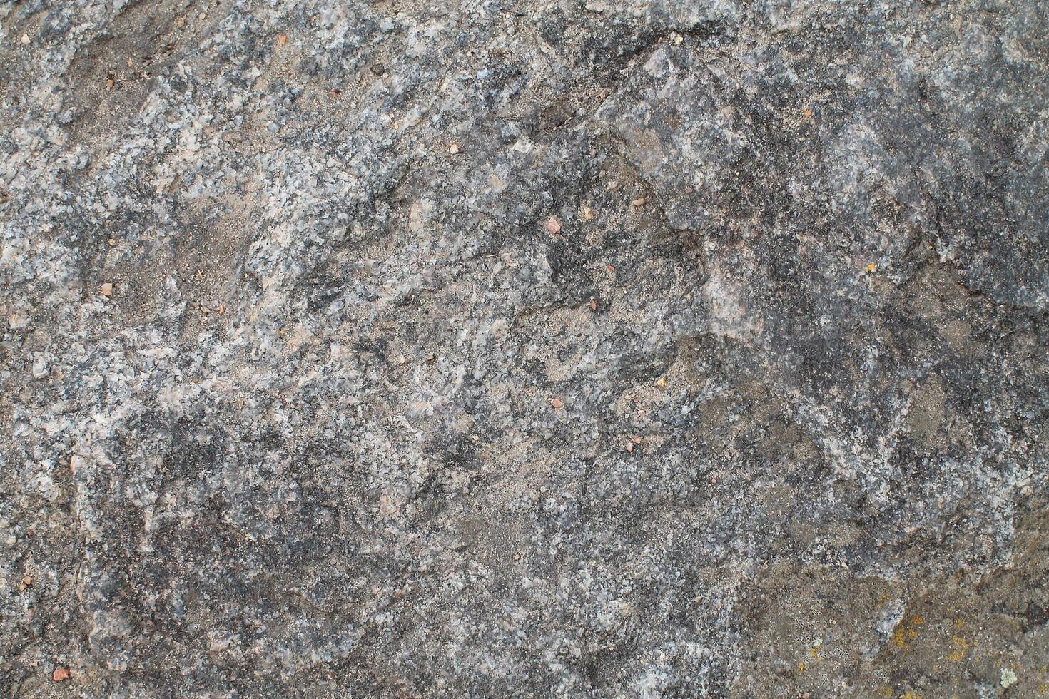 Abstract natural rock stone granite grunge rusty metal texture design background natural color stone material granite design wallpaper. Close-up detail of natural stone photo