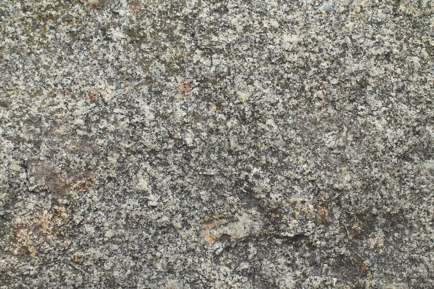 Abstract natural rock stone granite grunge rusty metal texture design background natural color stone material granite design wallpaper. Close-up detail of natural stone photo