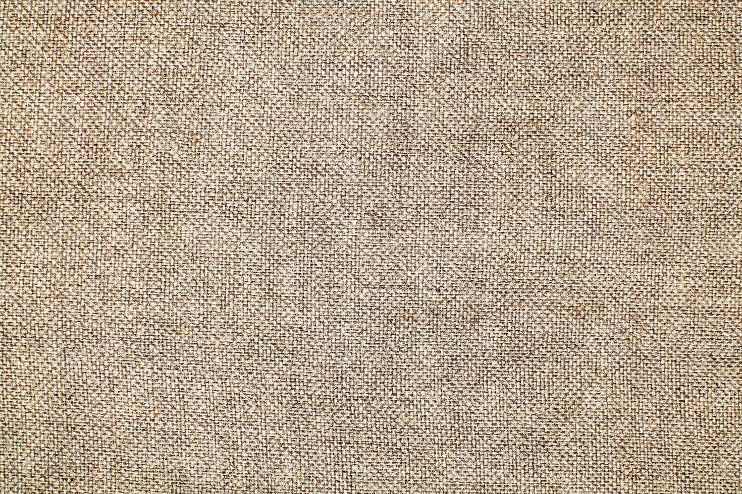 Natural linen material textile canvas Fabric texture background Close-up detail of fabric natural color Hemp material pattern design wallpaper. can be used as background or for graphic design photo