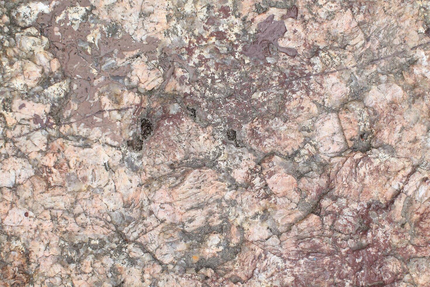 Abstract natural rock stone granite grunge rusty metal texture design background natural color stone material granite design wallpaper. Close-up detail of natural stone photo