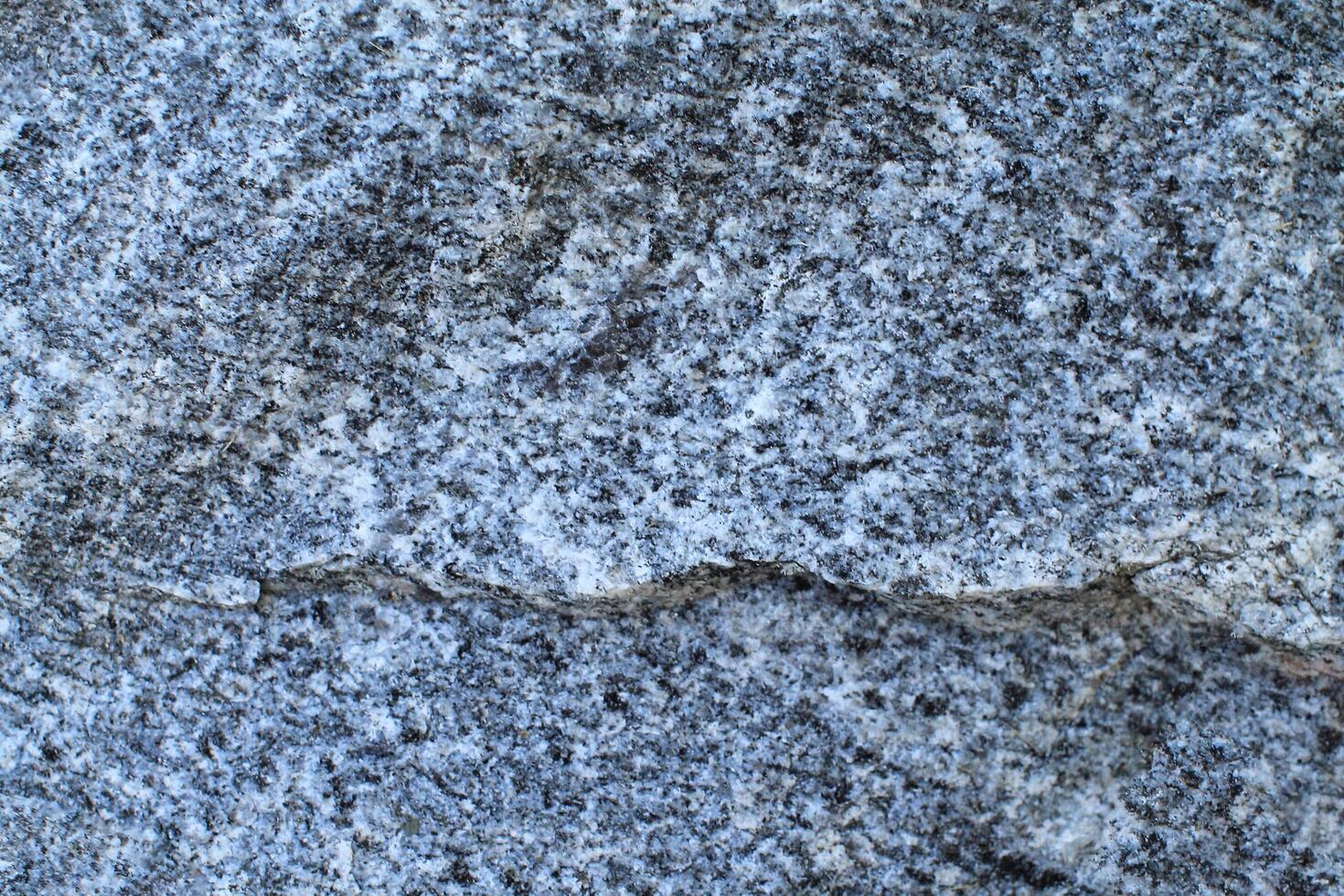 Abstract natural rock stone granite grunge rusty metal texture design background natural color stone material granite design wallpaper. Close-up detail of natural stone photo