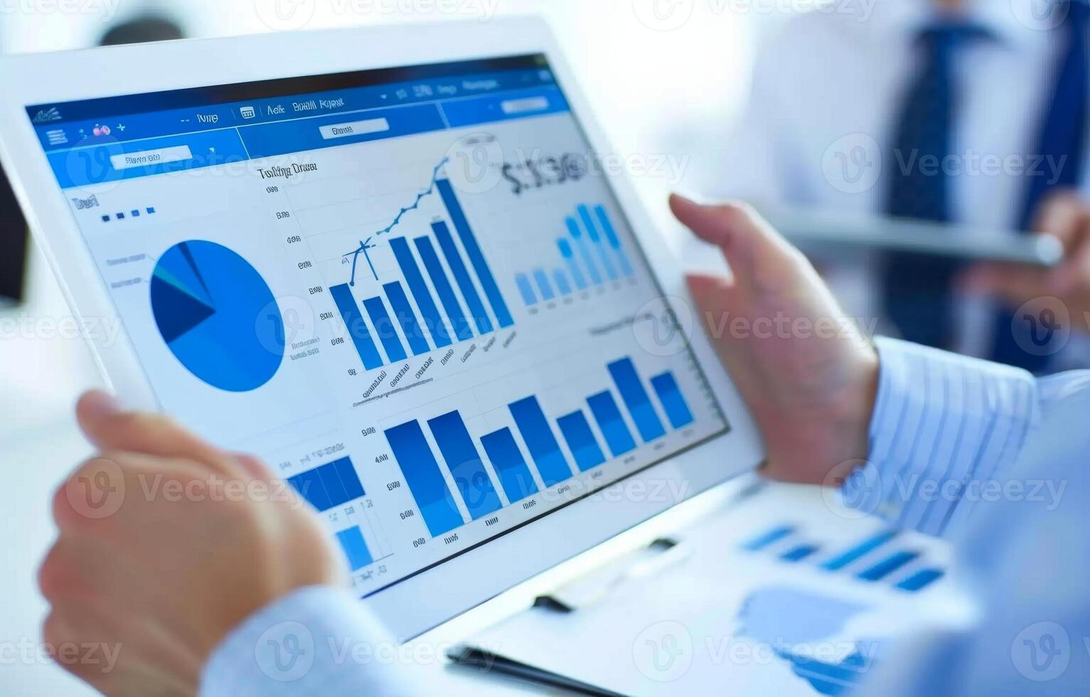 Businessman analyzing financial charts on digital tablet for business growth photo