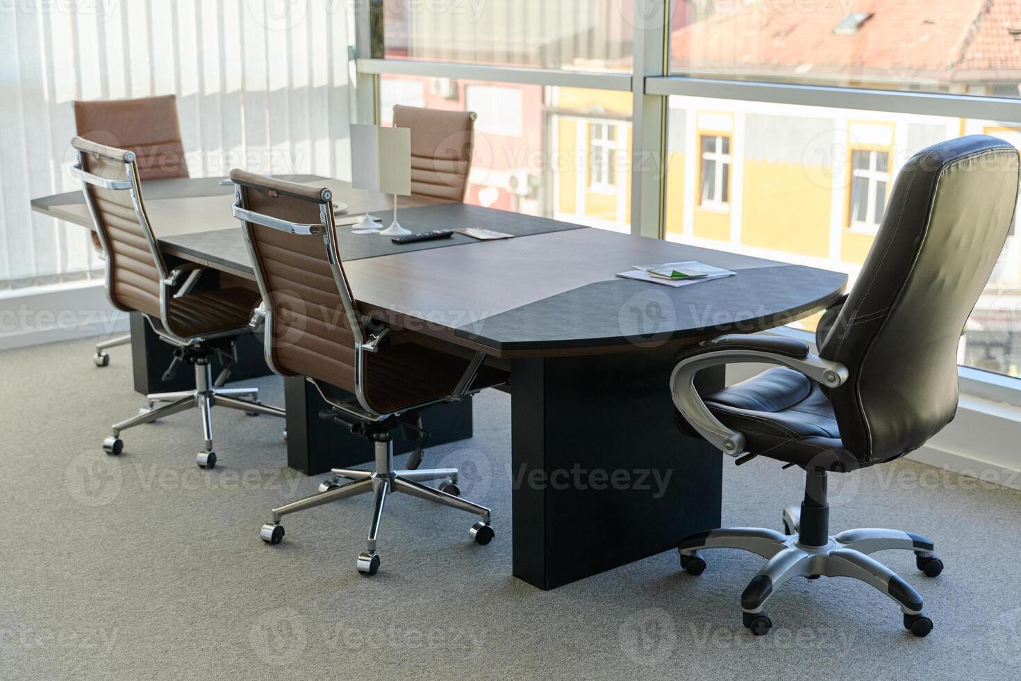 Modern Office Interior with Wooden Furniture, Conference Table, and Computers photo