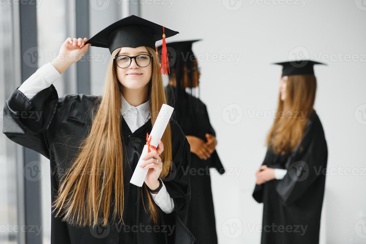 Educational theme graduating student girl in an academic gown. photo