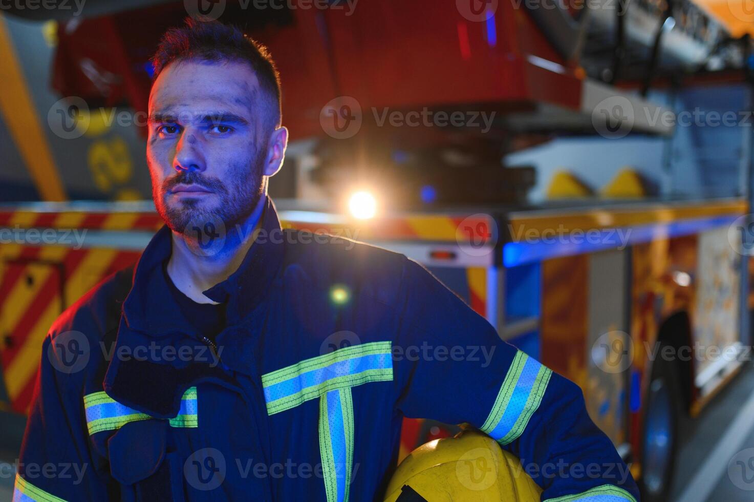 tired firefighter after work in a fire department photo