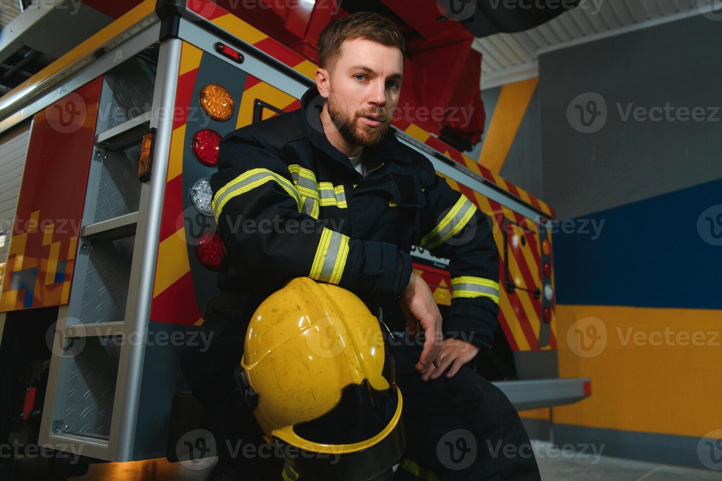 Photo of fireman with gas mask and helmet near fire engine