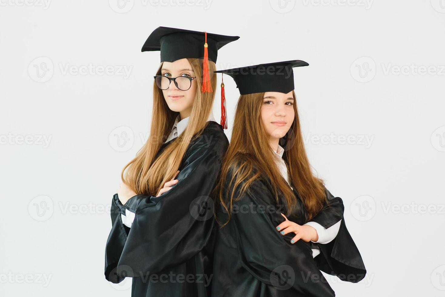 Pretty female college graduate at graduation with classmates photo