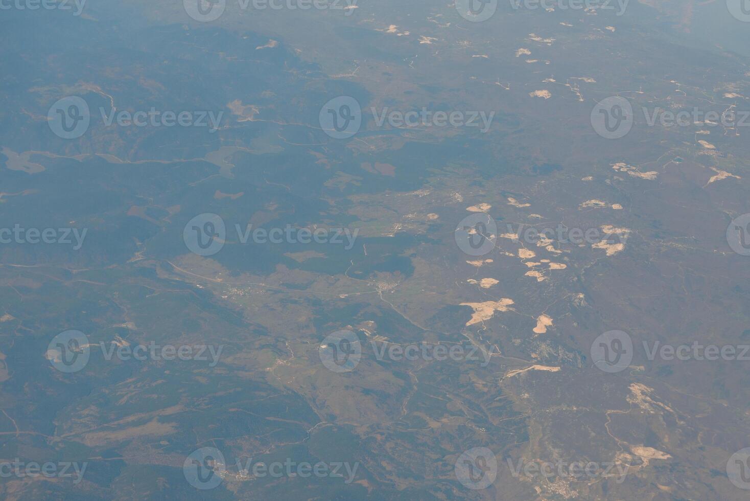 Looking through window aircraft during flight in wing with a nice blue sky photo