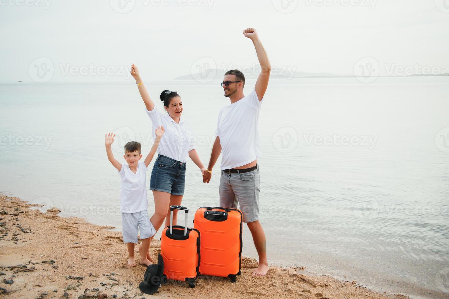 Happy family having fun on the beach. Summer vacation and travel concept photo