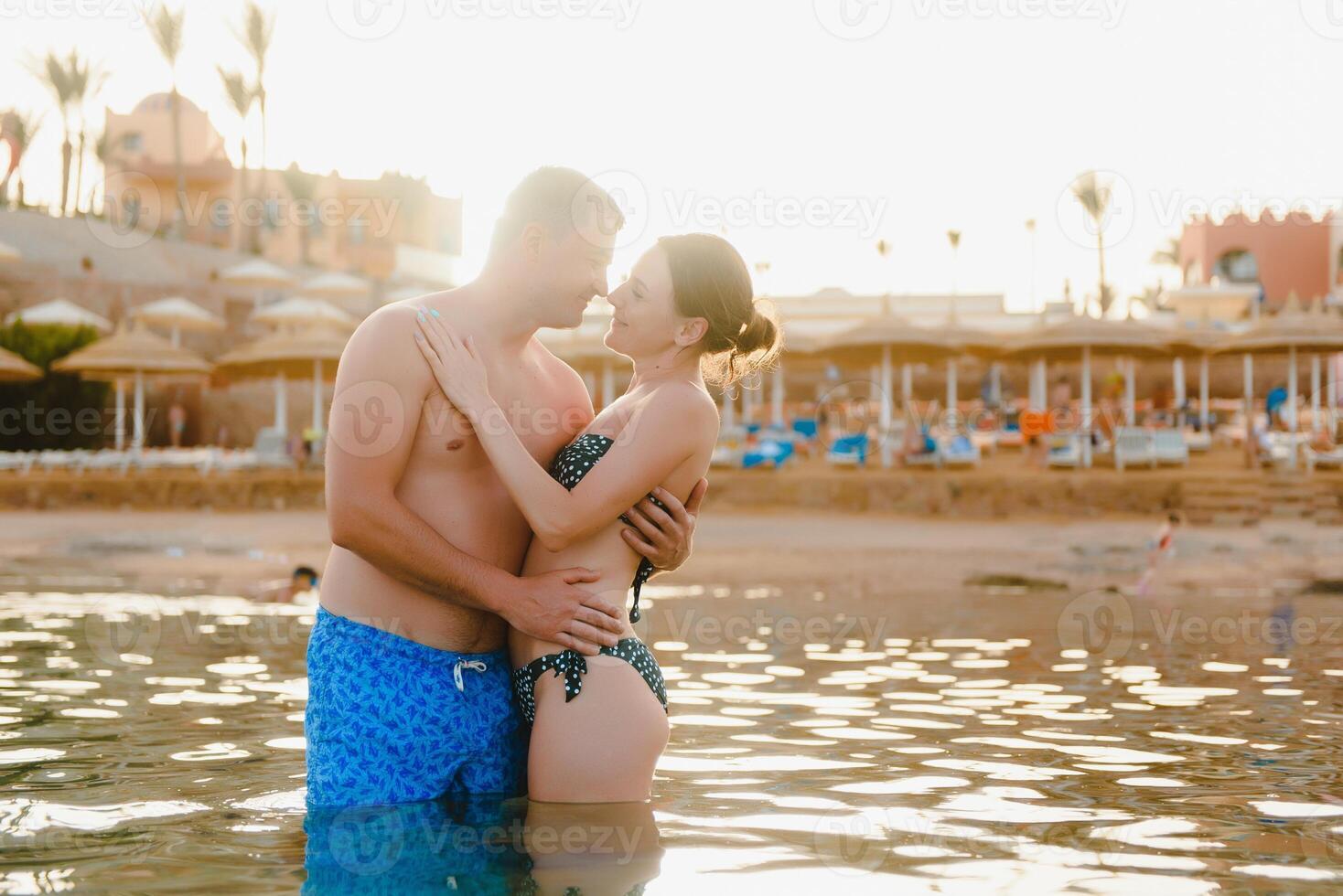 Happy young couple enjoying the sea photo