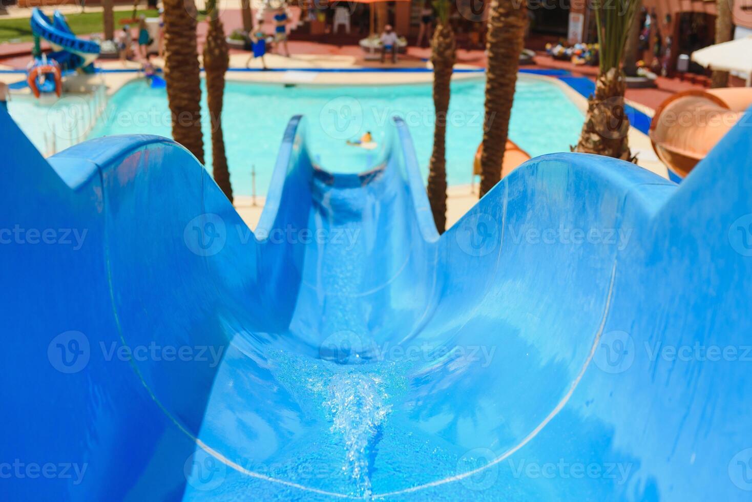 Colorful aquapark constructions in swimming-pool photo