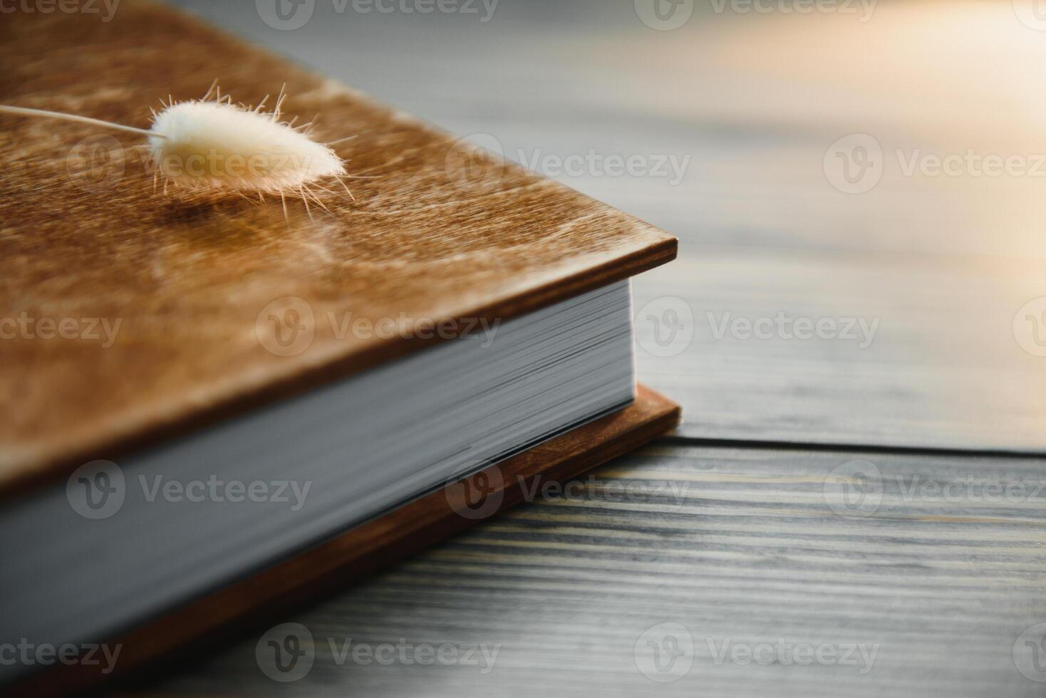 Luxury wooden photo book on natural background. Family memories photobook. Save your summer vacation memories. Photo album wedding photoalbum with wooden cover.