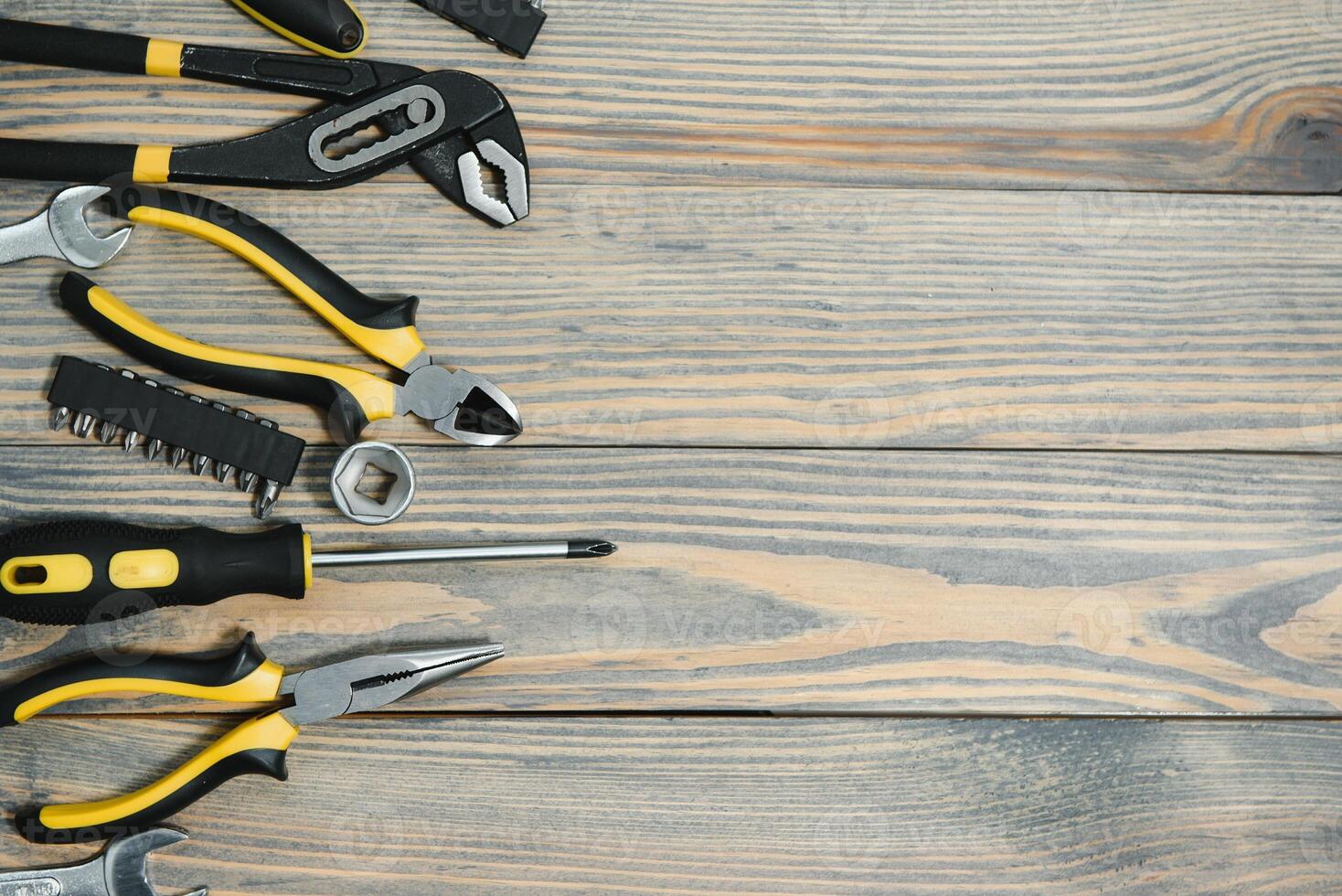 Different tools on a wooden background. photo