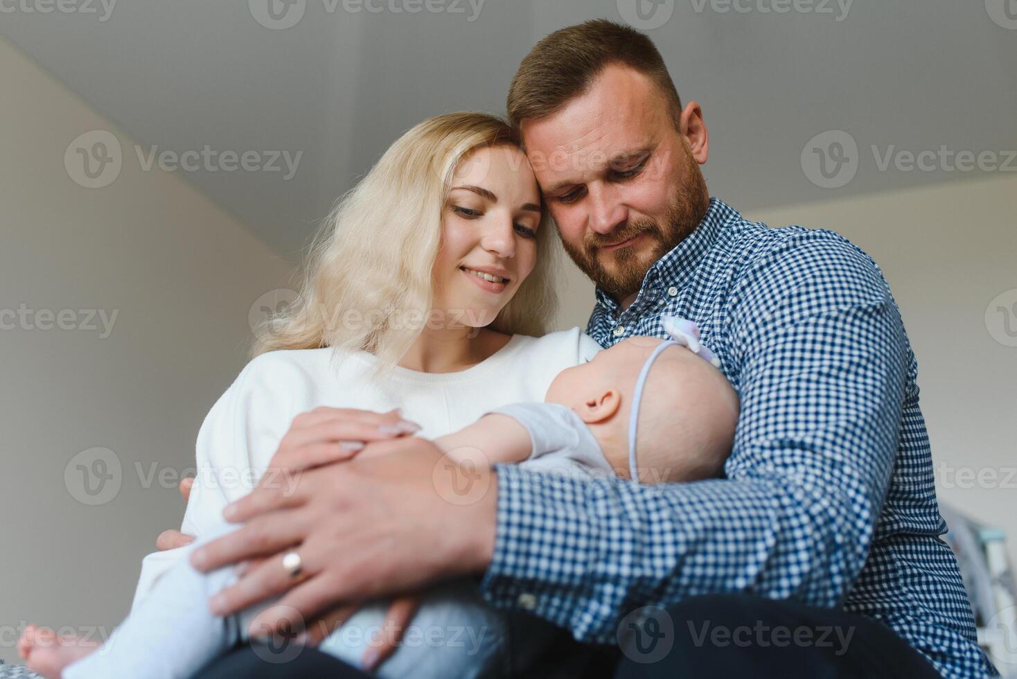 Portrait of a young happy family with the kid photo