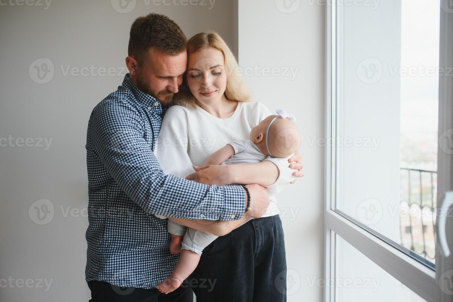 Portrait of a young happy family with the kid photo