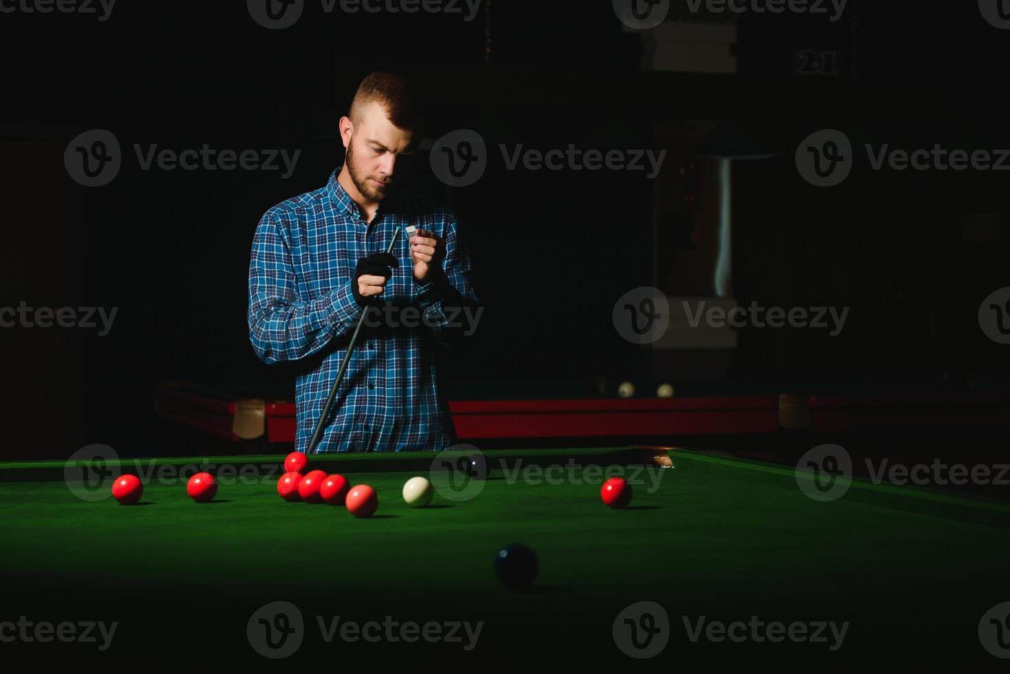 Playing billiard - Close-up shot of a man playing billiard photo