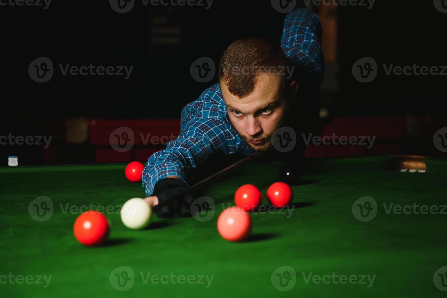 Playing billiard - Close-up shot of a man playing billiard photo