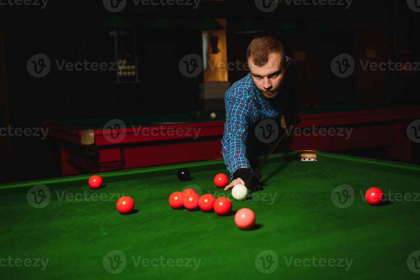 Playing billiard - Close-up shot of a man playing billiard photo