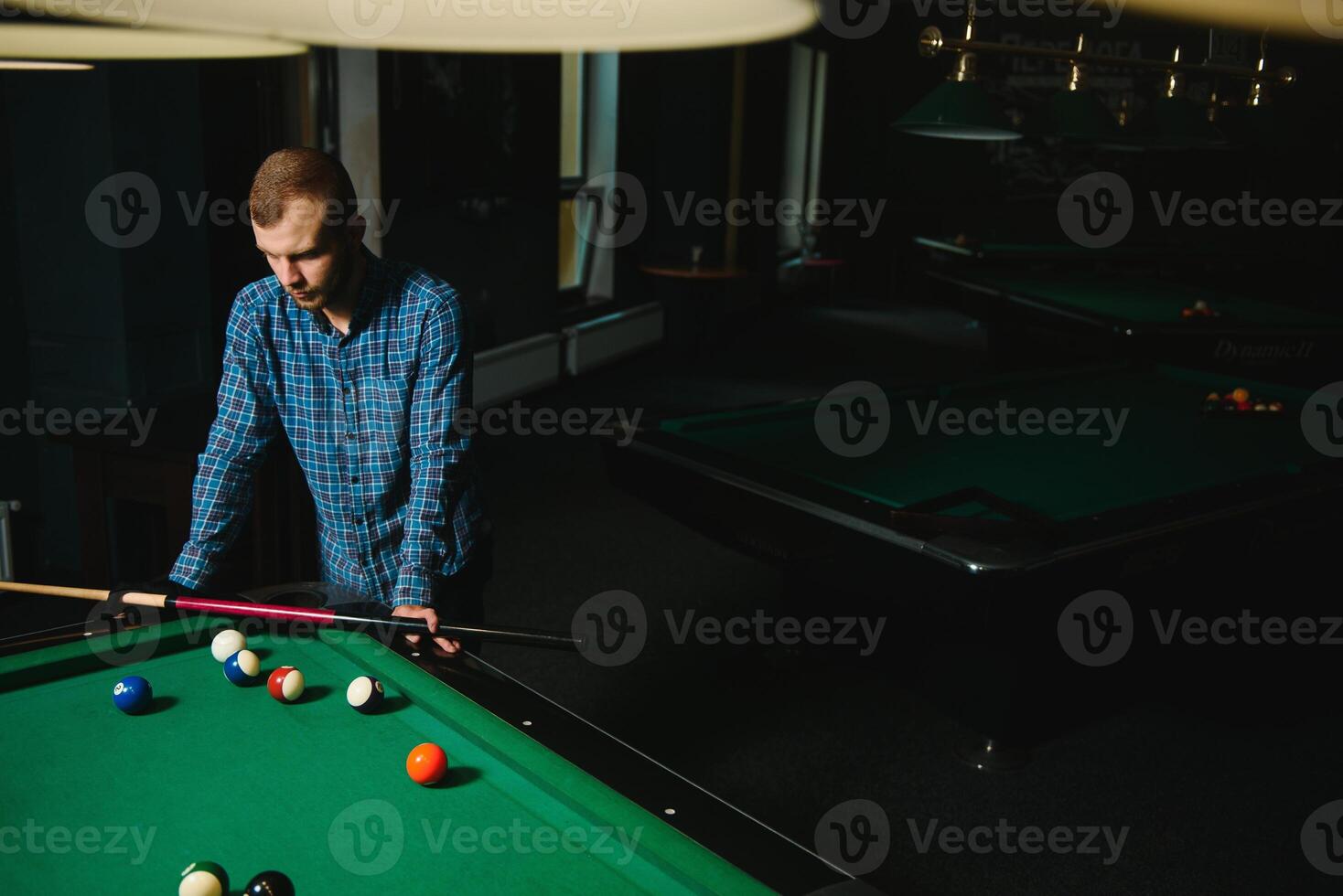 Playing billiard - Close-up shot of a man playing billiard photo
