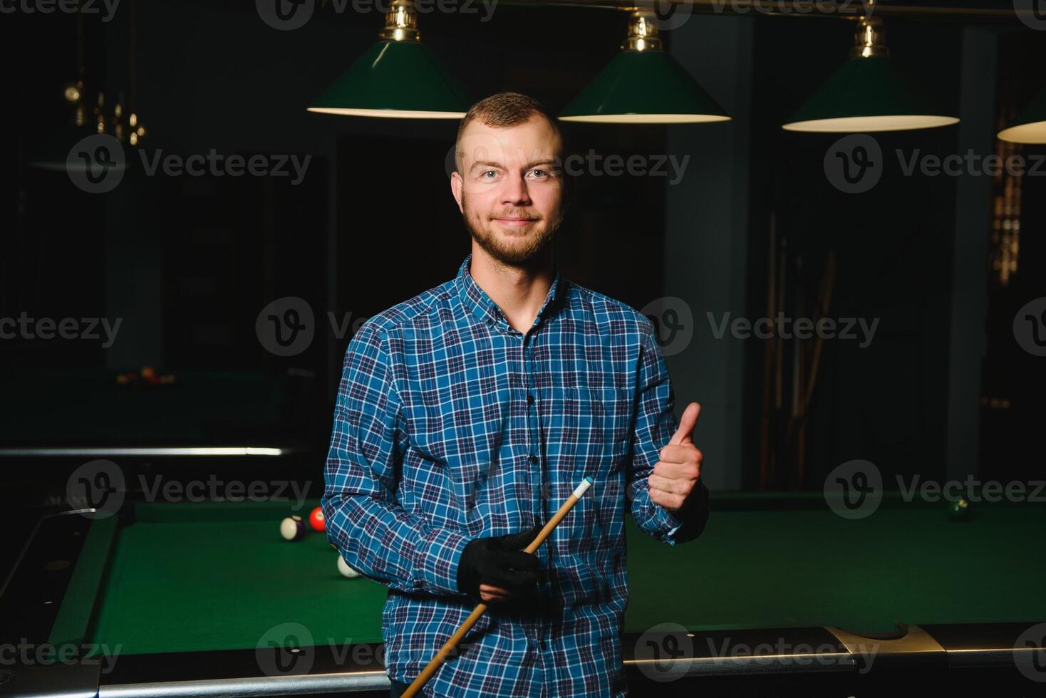 Playing billiard - Close-up shot of a man playing billiard photo