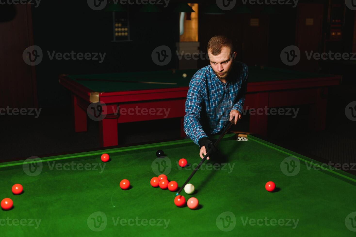 Playing billiard - Close-up shot of a man playing billiard photo