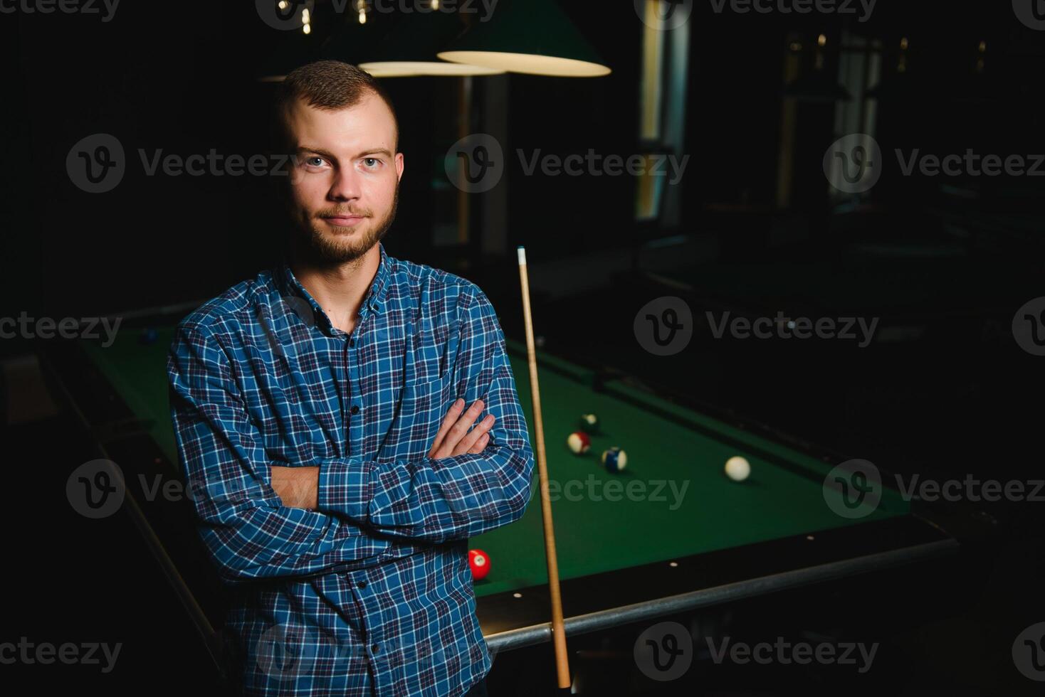 Playing billiard - Close-up shot of a man playing billiard photo