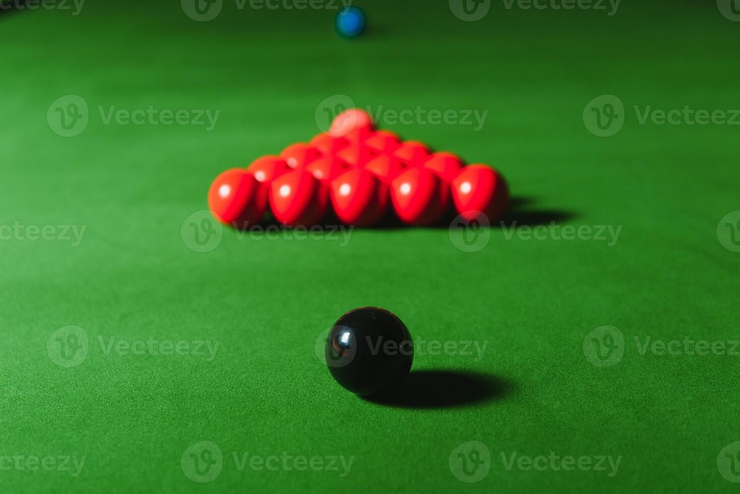 snooker balls on green surface, shallow depth of field photo