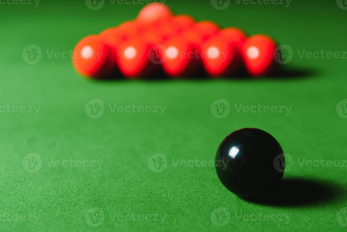 snooker balls on green surface, shallow depth of field photo