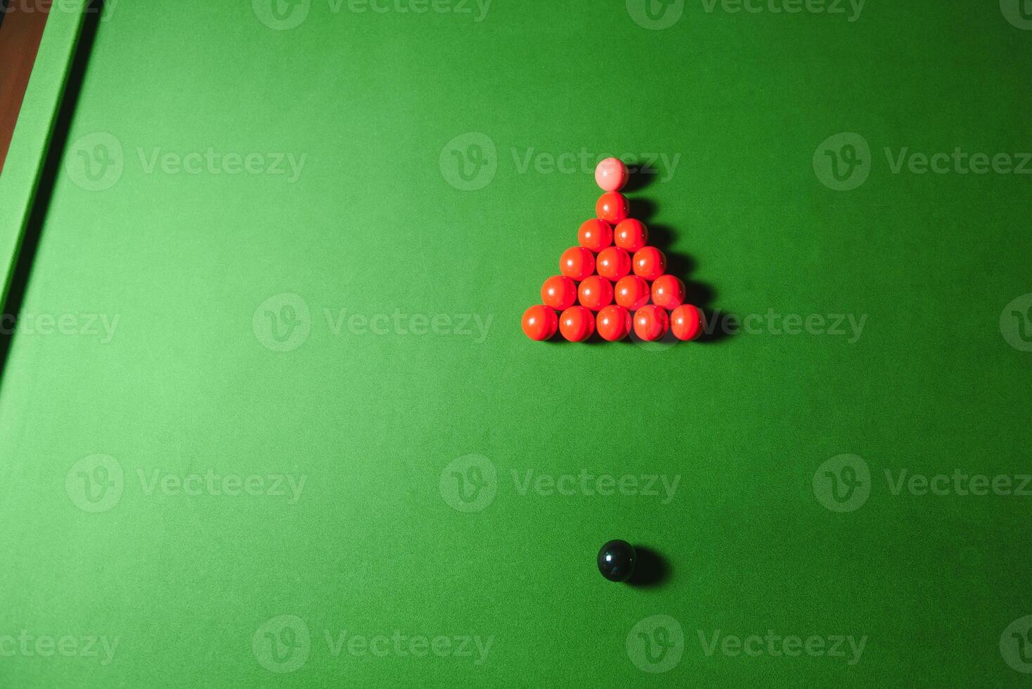 snooker balls set on a green table photo